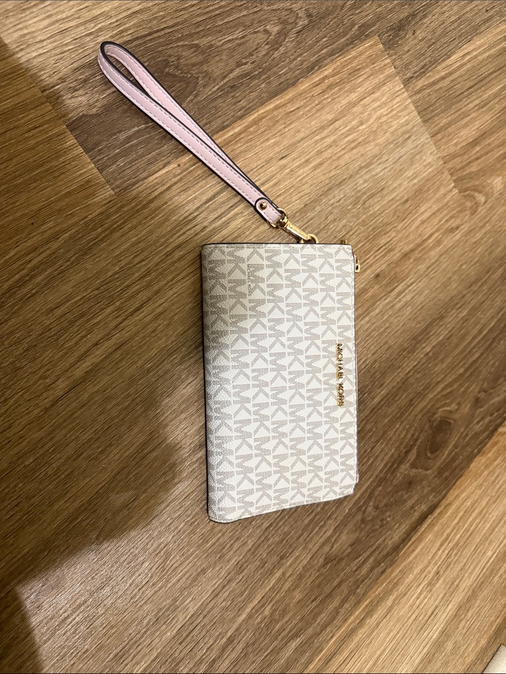 Michael Kors Vanilla Logo Wristlet with Pale Pink Strap